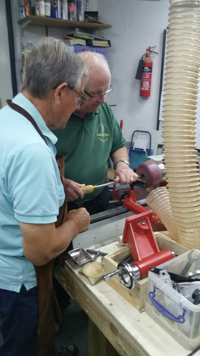 Terry showing Doug the finer points of turning